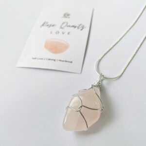 Rose Quartz tumblestone wrapped in silver wire on a sterling silver necklace.